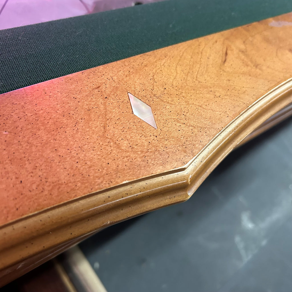 Scalloped rail with diamond site in a light mahogany finish