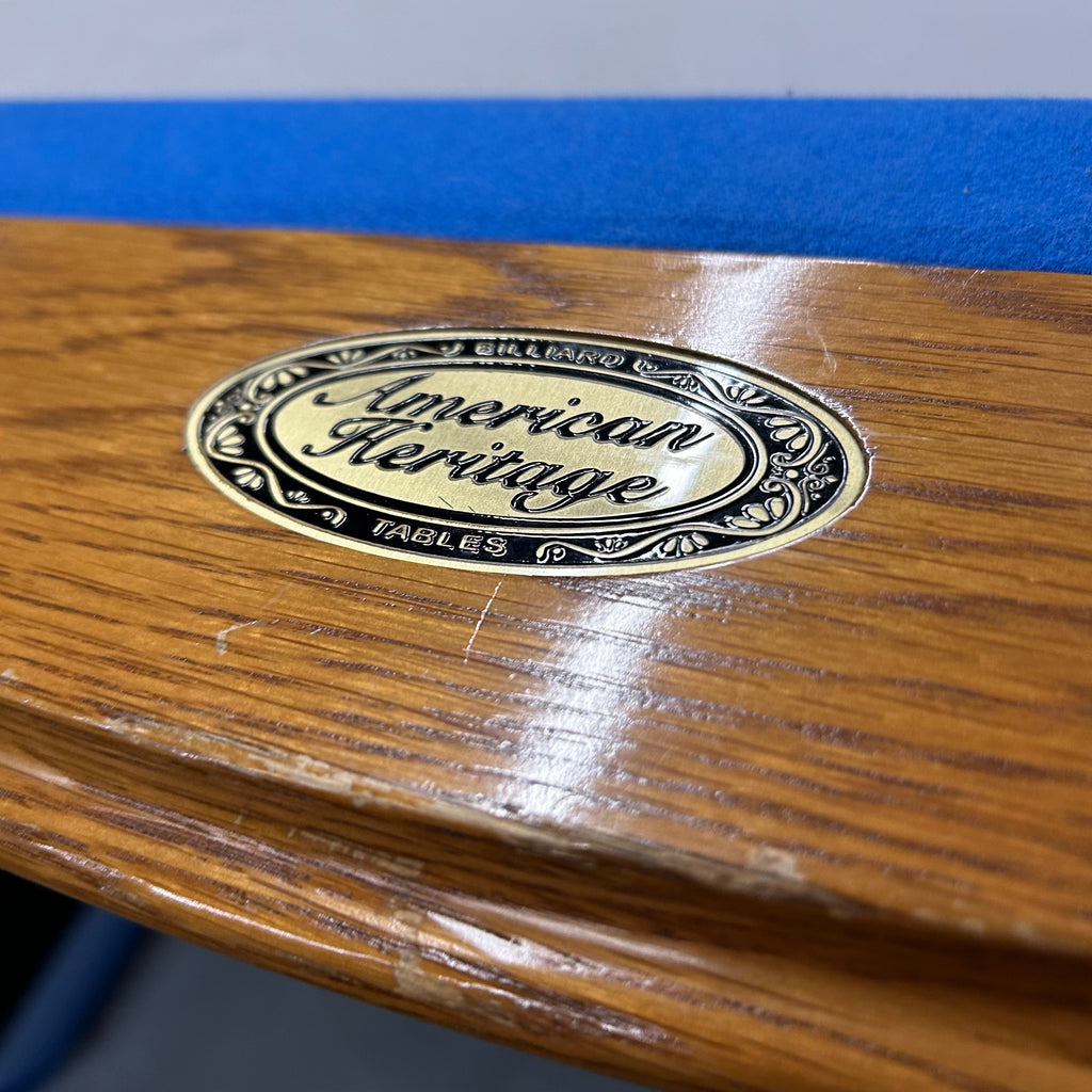 American heritage logo plate on oak rail with blue cloth