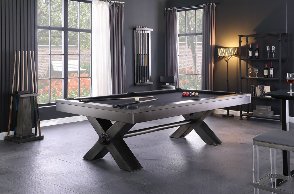 Vox stainless steel pool table in room with cues and charcoal felt