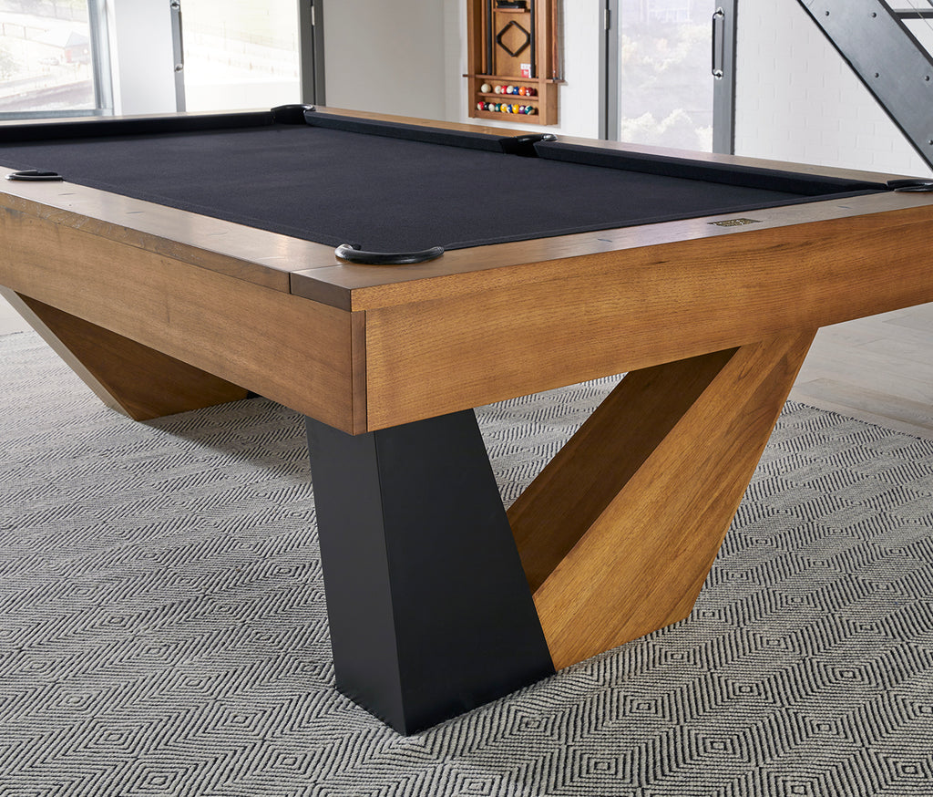 Annex pool table in walnut finish showing black leg and black felt in room on rug