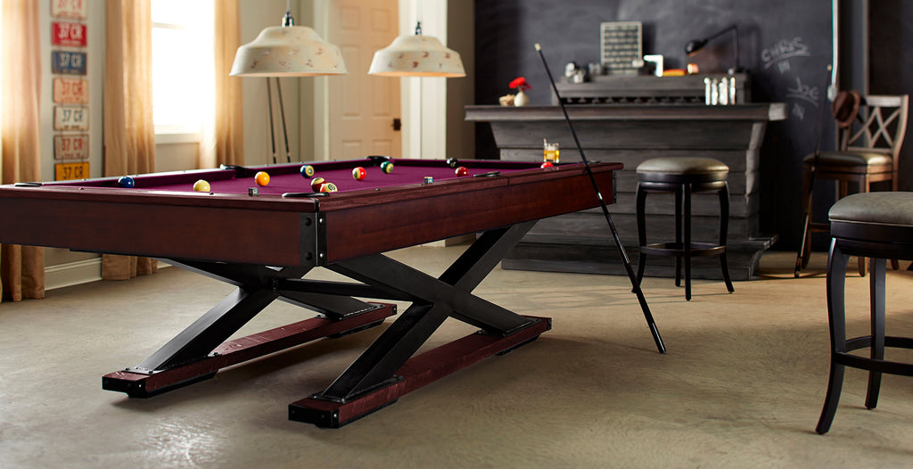 Glacier pool table with criss crossed base in navajo finish with wine felt in room