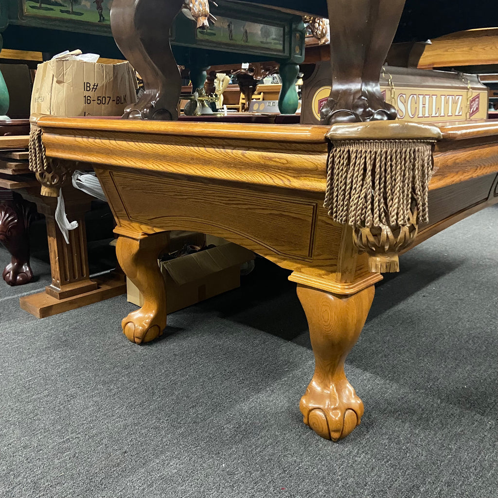Oak pool table with ball and claw leg and fringe pocket