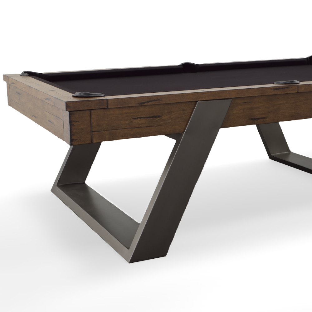 Closeup of leg and cabinet of pool table in whiskey finish with black felt