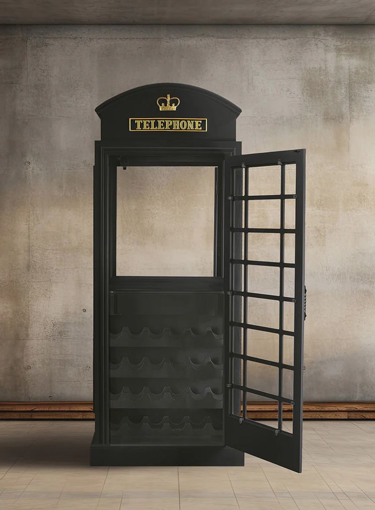 Black phone booth with telephone on top and wine storage