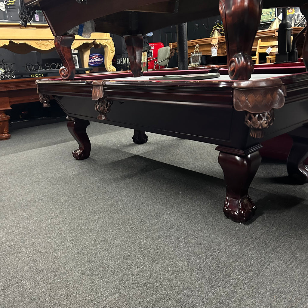 Overall view of mahogany imperial pool table with ball and claw leg and shield pocket