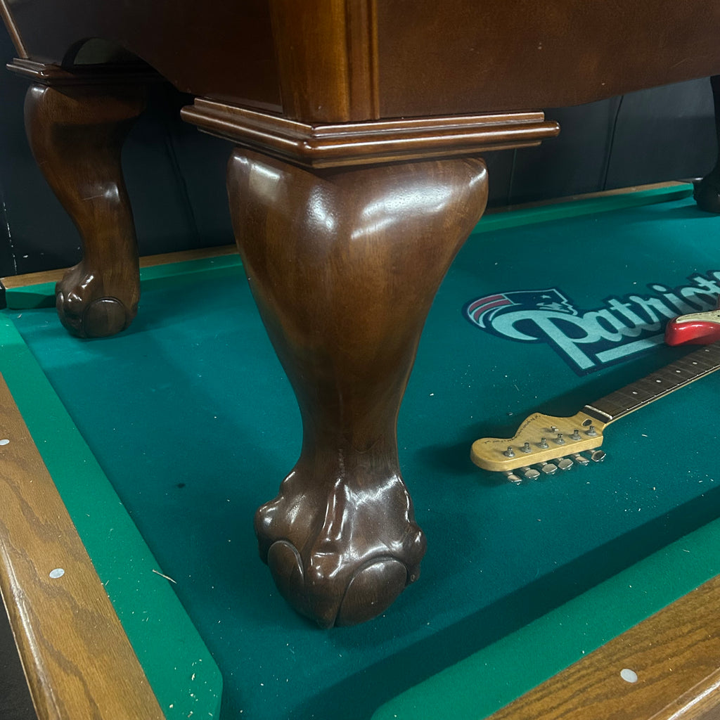 Ball and claw leg on pool table in walnut 