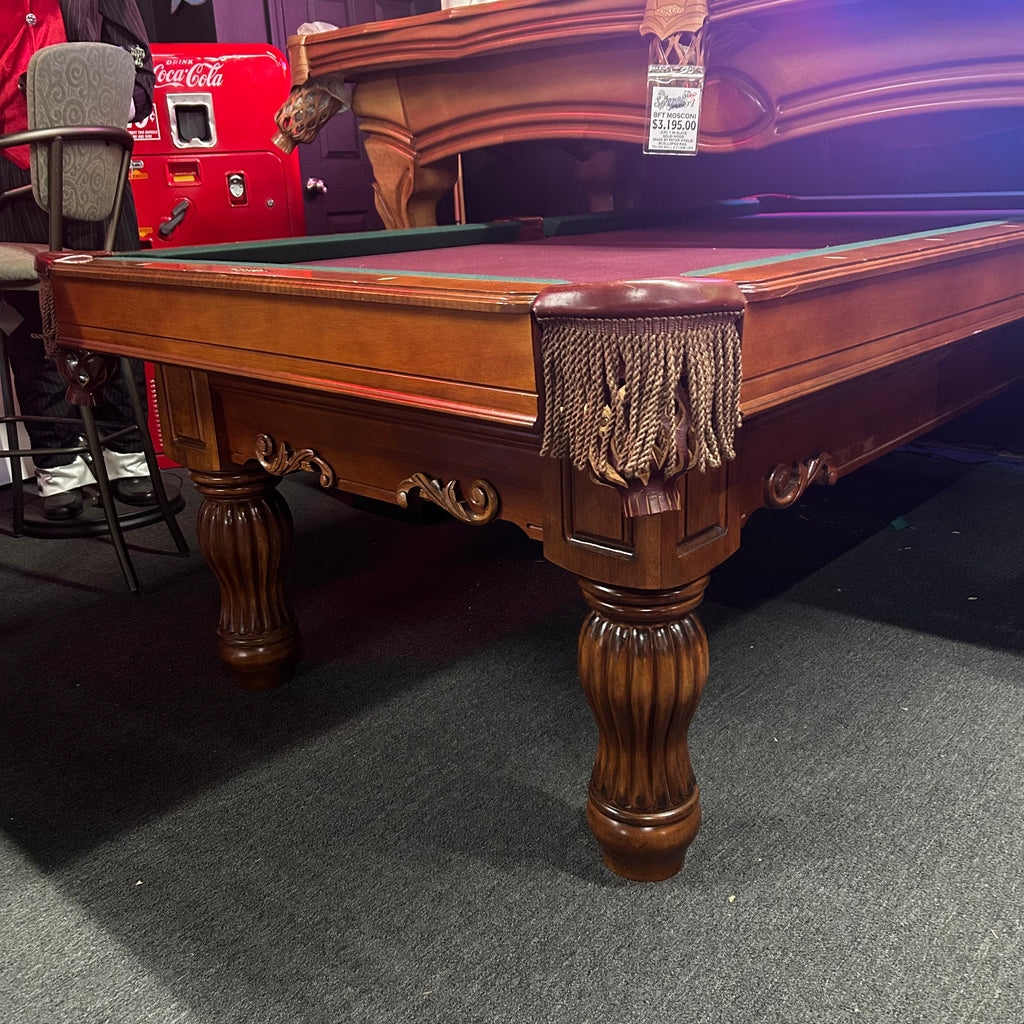 Brunswick pool table with fringe pocket and turned legs from right side