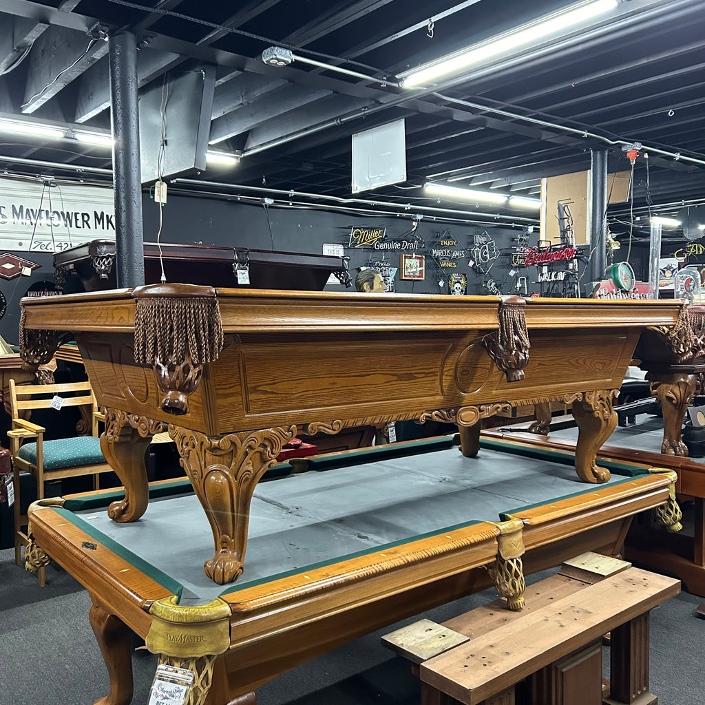 Side view of pool table in oak finish 