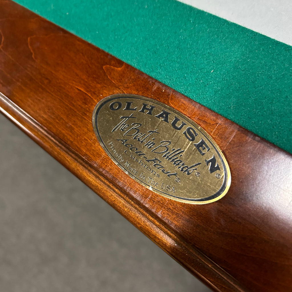 Olhausen name plate on rail with The Best in Billiards written