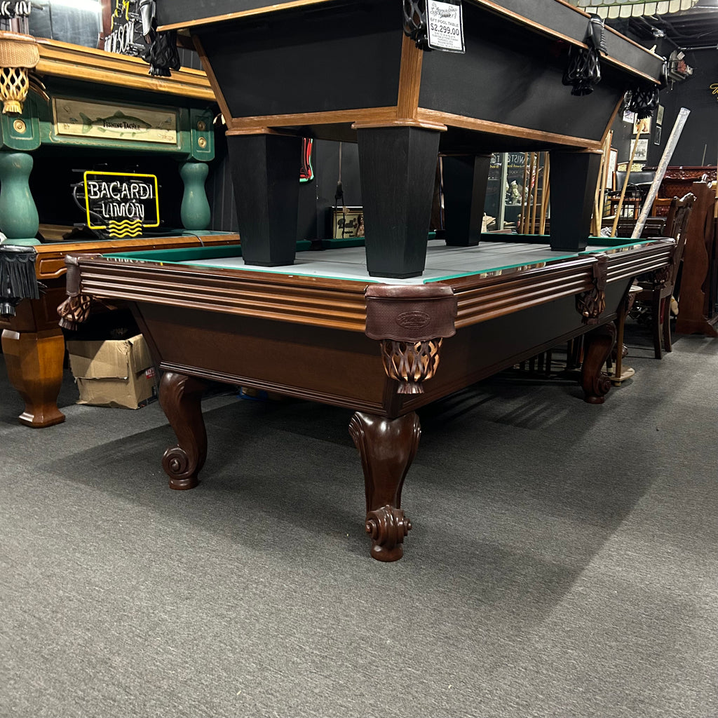 Overall view of olhausen pool table with leather shield pocket in mahogany finish