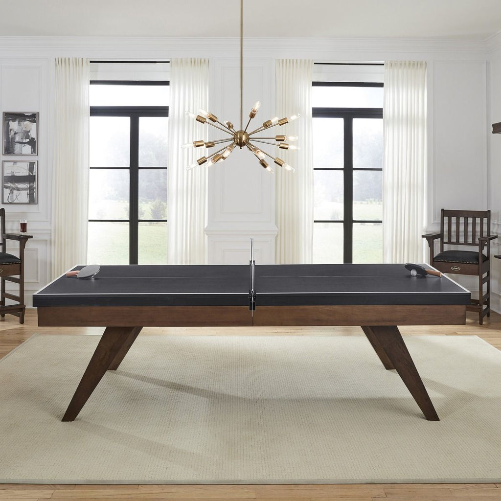 Thick black table tennis conversion top with net side view in room
