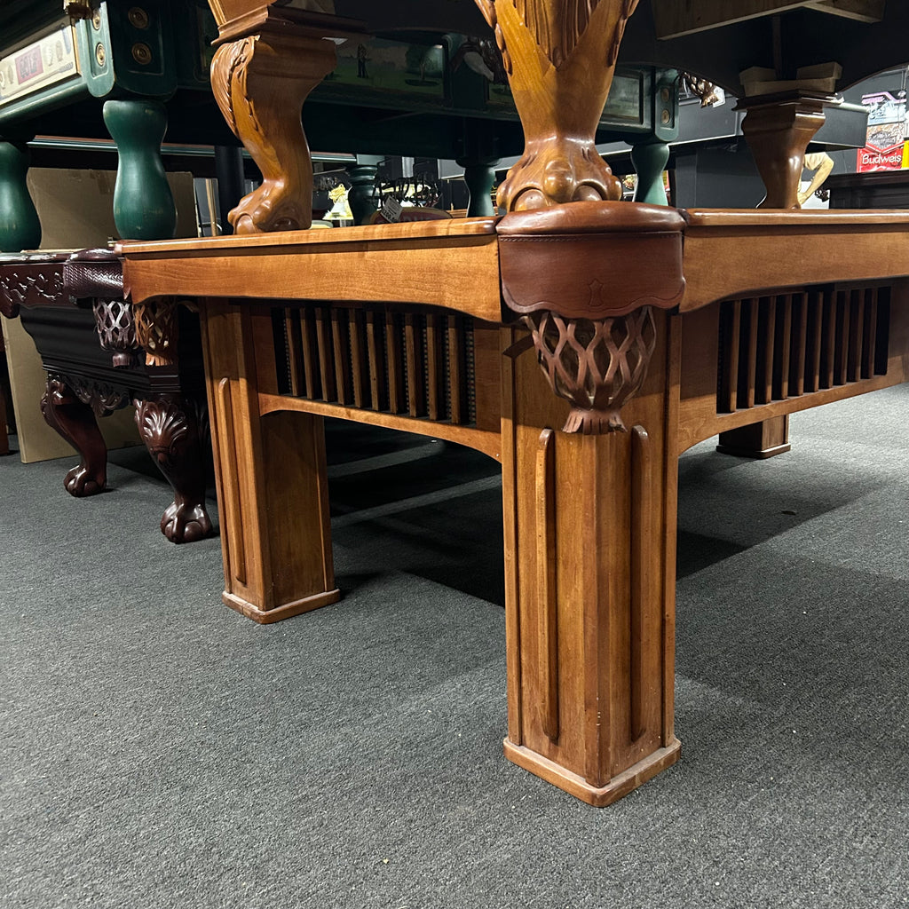 Corner view of Beach pool table with square legs and peekaboo cabinet details