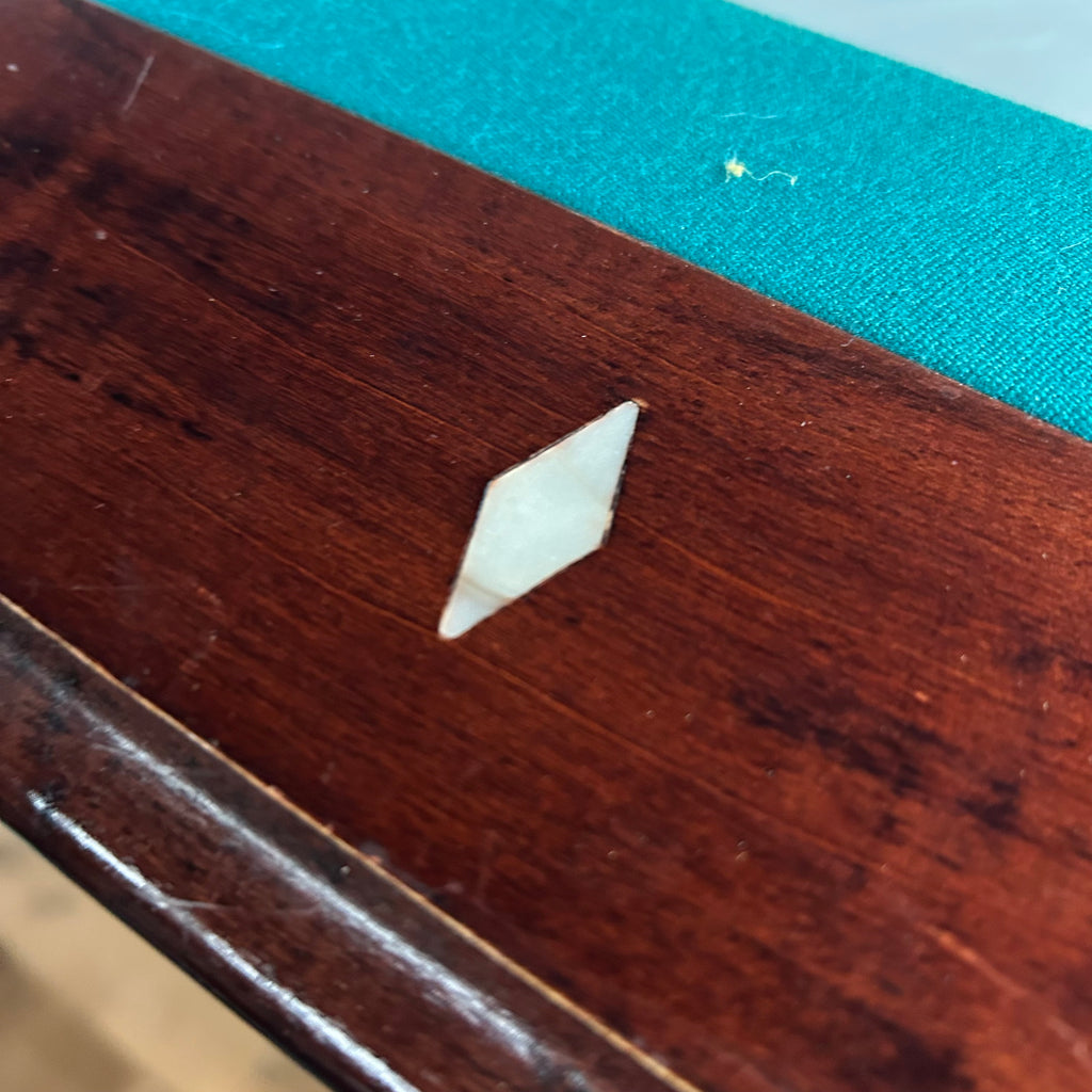 Diamond rail site on mahogany rail and green cloth