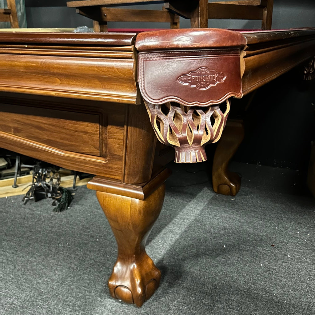 Corner view of Brunswick glenwood pool table with shield pocket and ball and claw leg