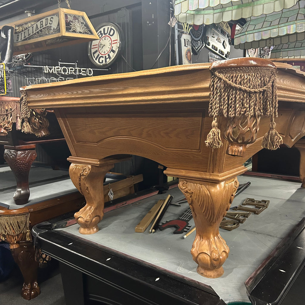 Decorative pool table with ornate legs and tassels