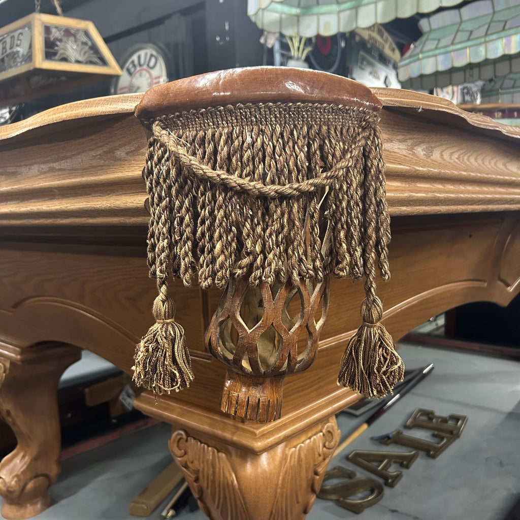 Tassel fringe tan pocket with pecan leather trim on pool table