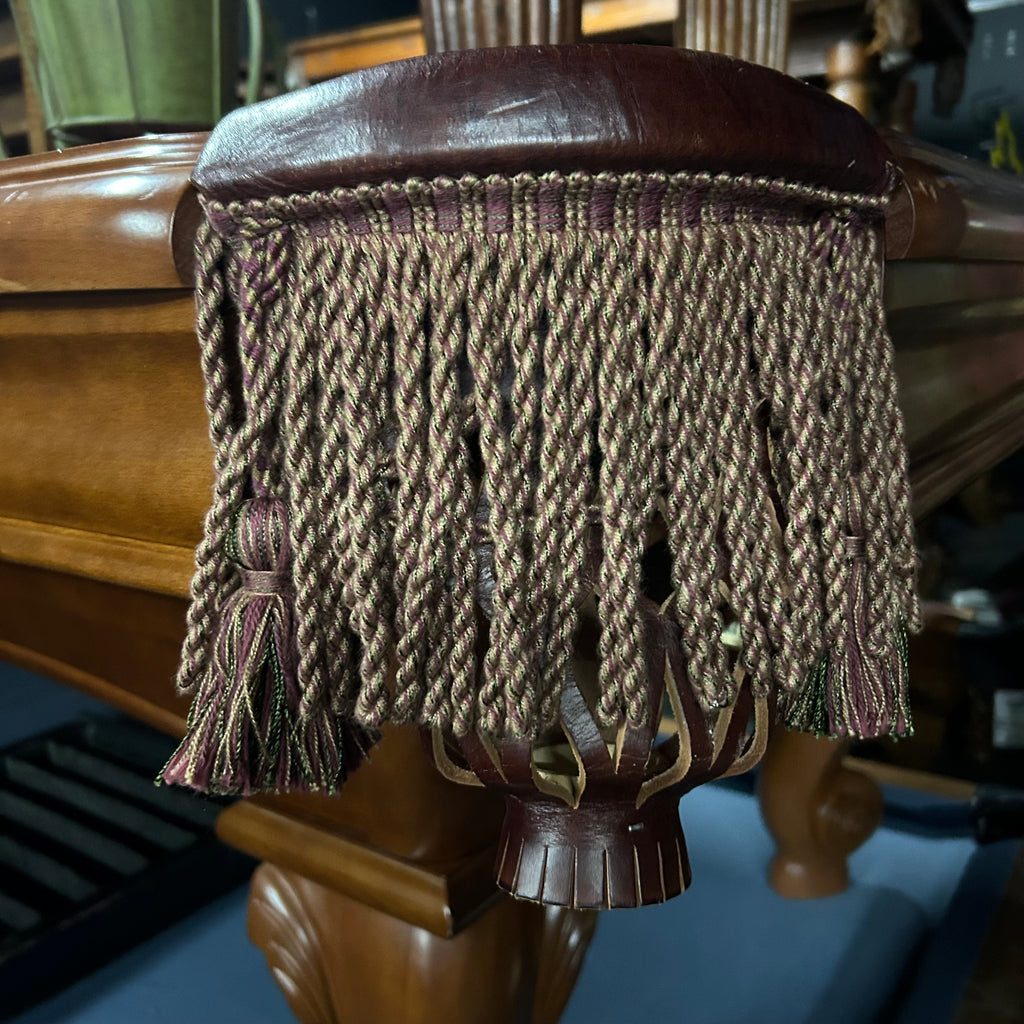 Fringe pocket on pool table with fringe pocket with green and wine weave