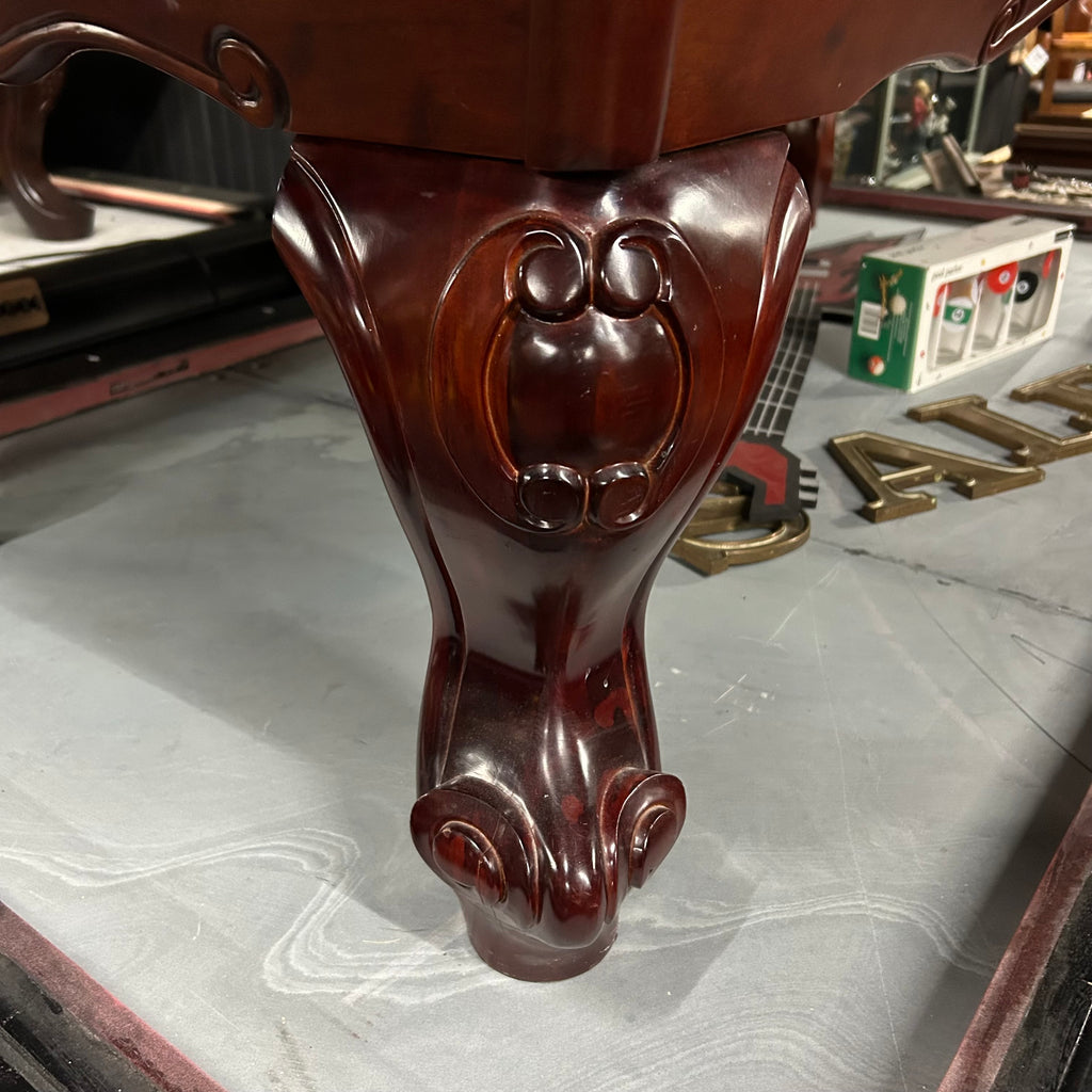 Close up of mahogany finish pool table leg rams horn