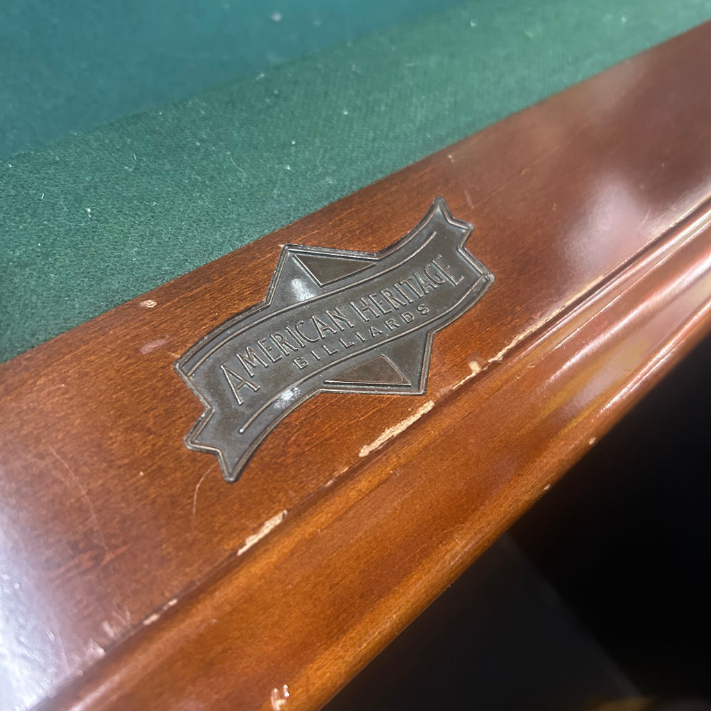 American heritage label on pool table rail with dark green felt