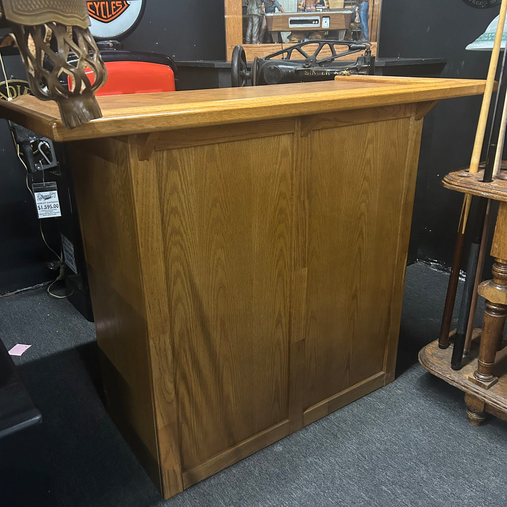 Front of mini bar in oak finish