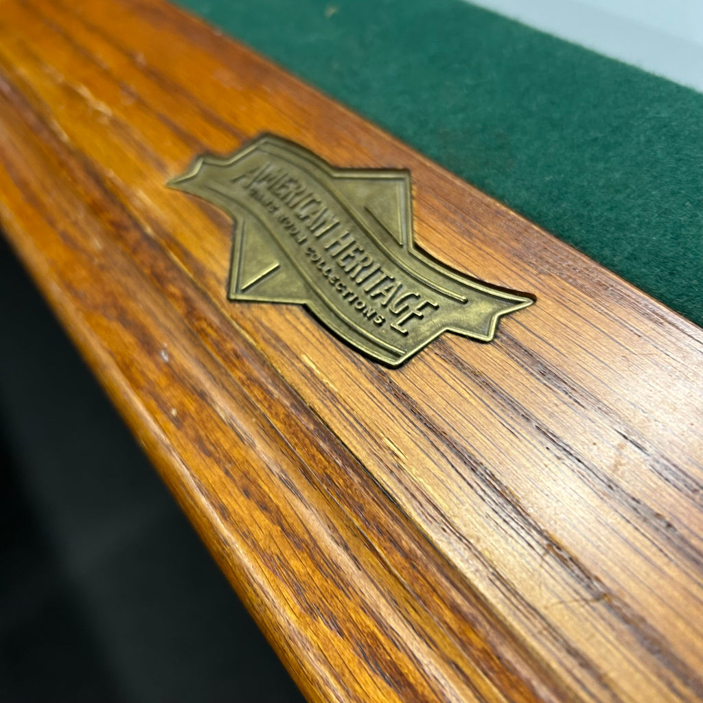 American heritage logo on oak pool table rail with green felt