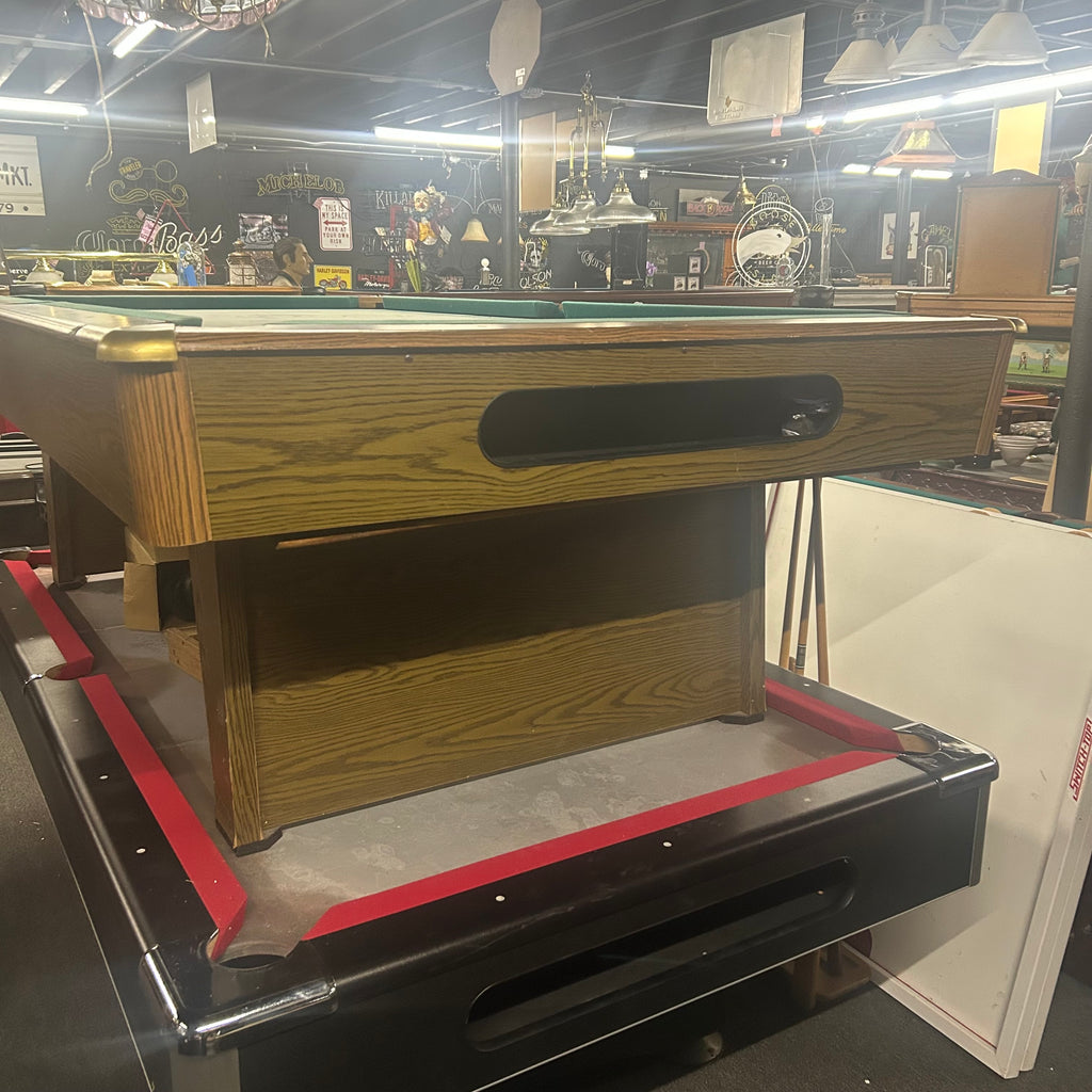 End view of ball box of used pool table with brass corner caps and pedestal leg