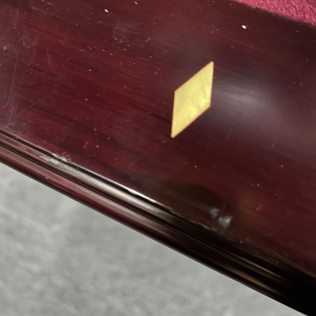 Diamond rail site on mahogany pool table rail