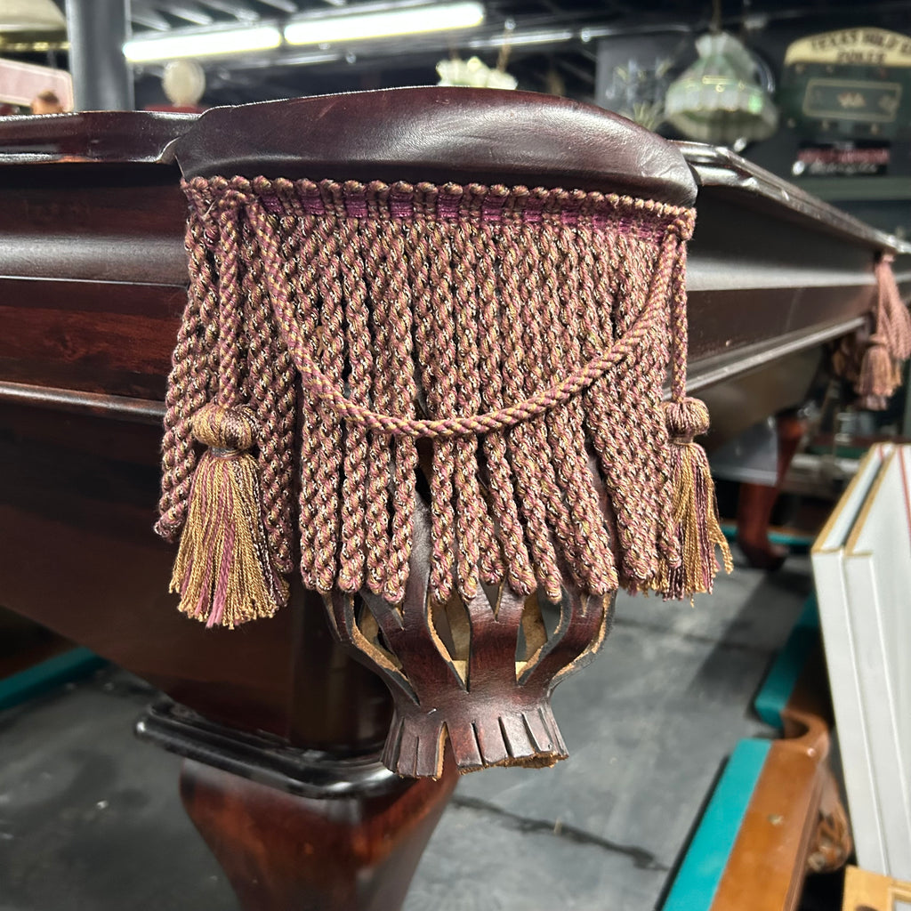 Fringe pocket with multi colored weave and mahogany leather iron