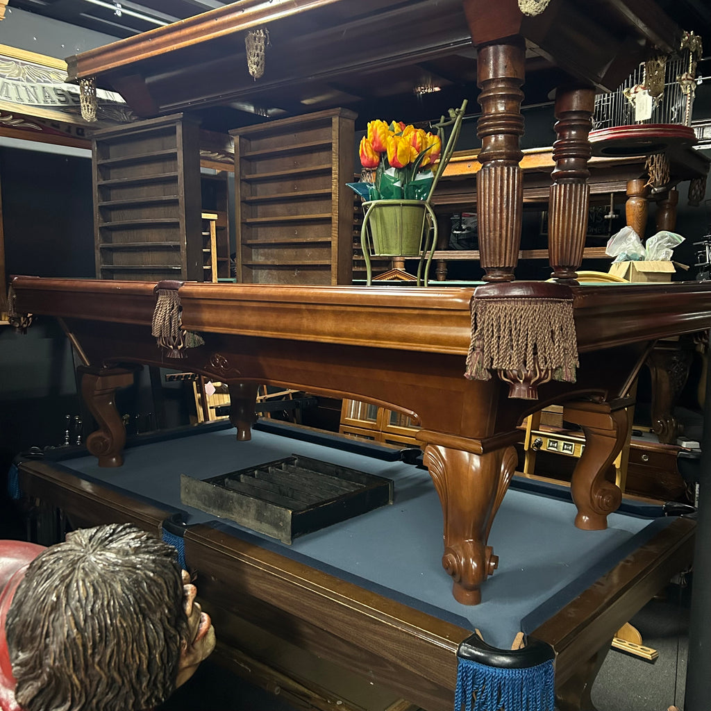 Overall view of camden pool table in chestnut finish with fringe pocket and rams horn leg
