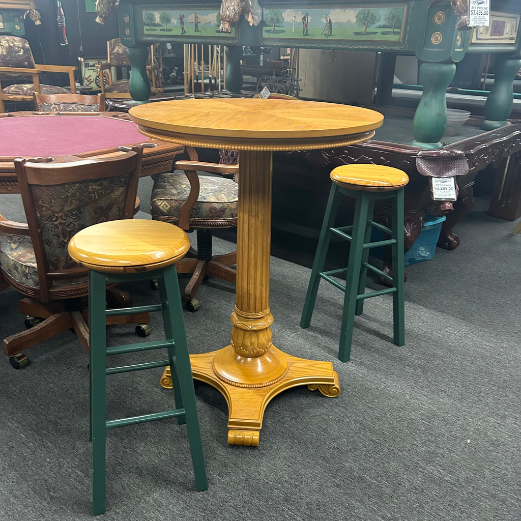 Oak pub table with two oak and green stools from side view