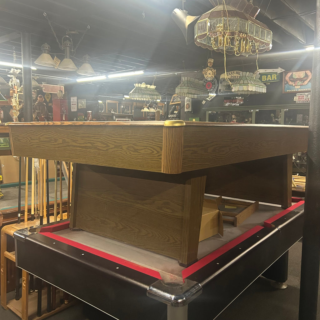 Overall view of pool table with brass corner caps and pedestal leg