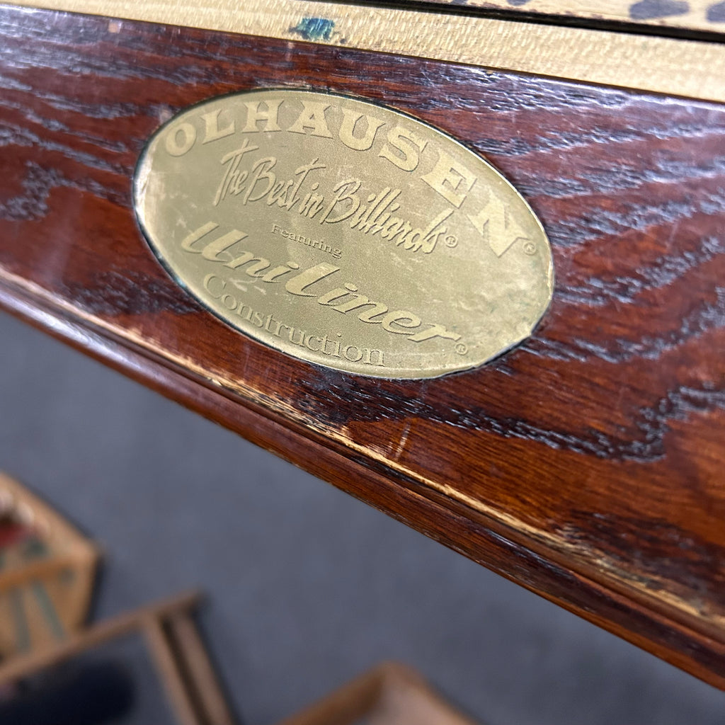 Olhausen logo with the best in billiards written inside on rail