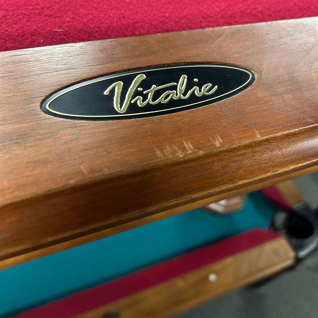 Closeup of Vitalie logo on black rail plate on rail