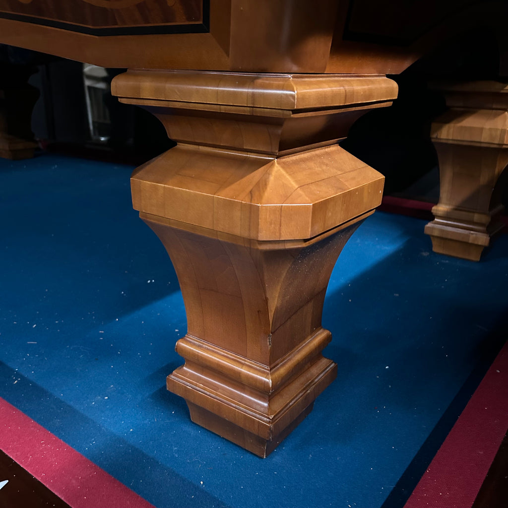 Closeup of pool table leg with fancy taper