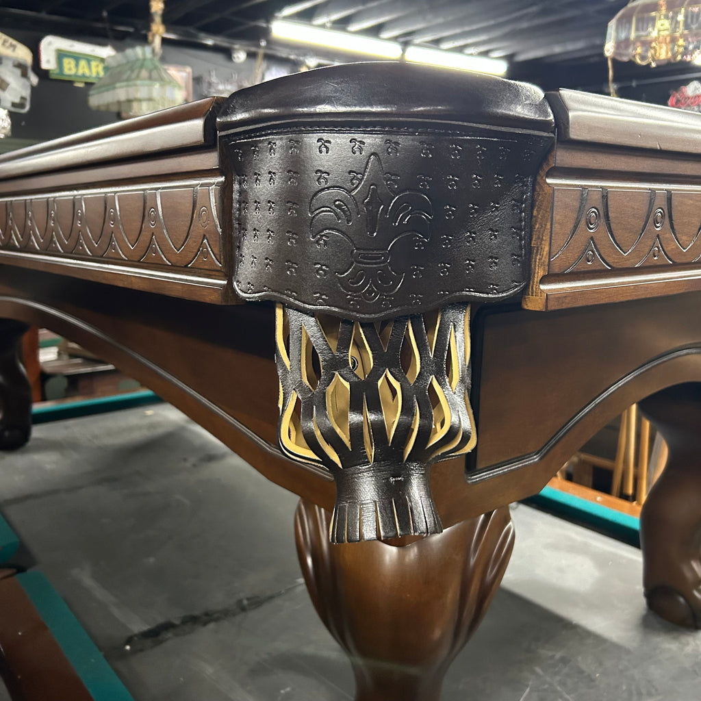Dark brown leather shield pocket on brown pool table