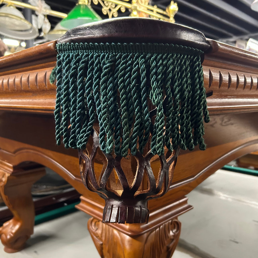 Green fringe pocket on pool table