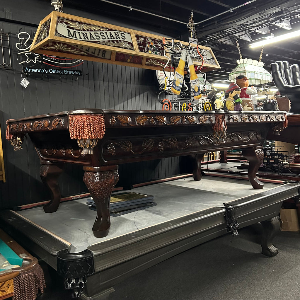 Overall view from left side of pool table with queen ann leg and carved details