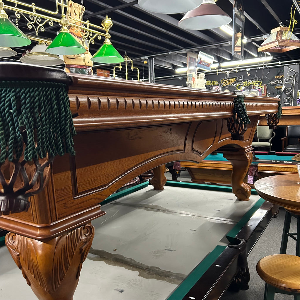 Routed apron on side of pool table with green fringe pocket