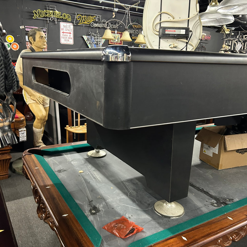 Corner view of eliminator pool table with pedestal base leg and chrome corner castings