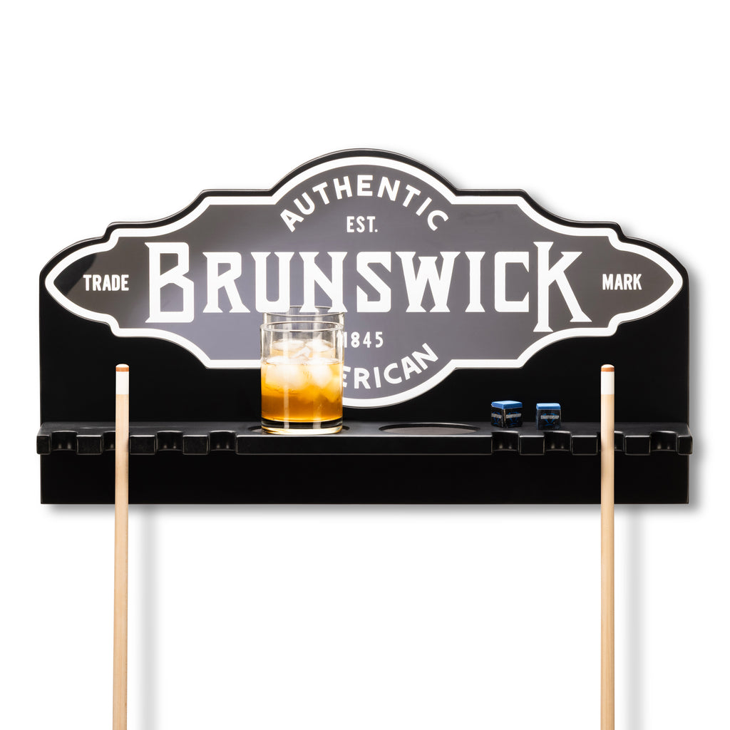 Brunswick pool cue rack with a glass of whiskey on a white background