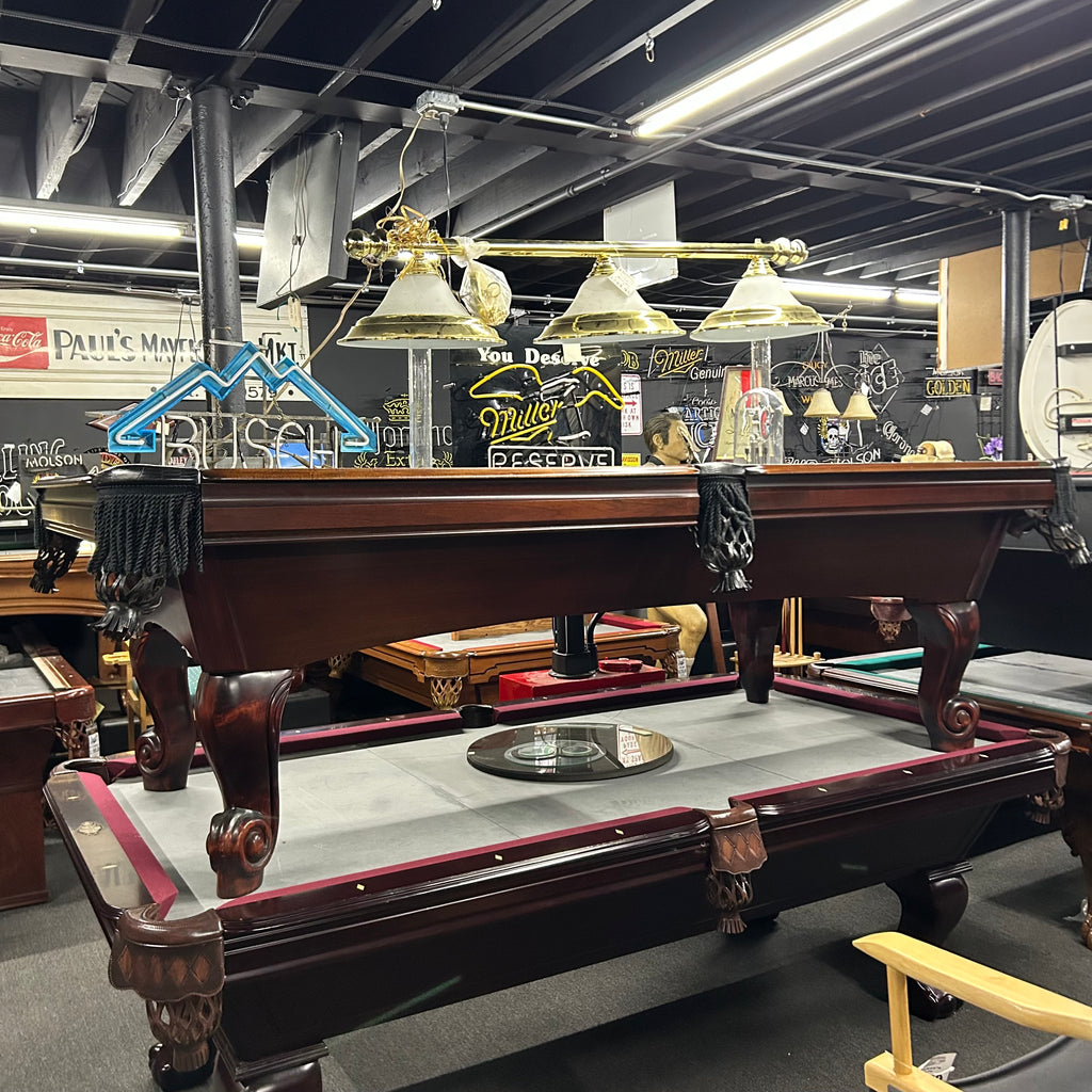 8ft AMF pool table with black fringe pockets and rams horn leg overall from front