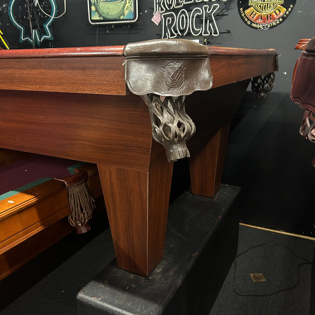 Corner of 8ft used pool table in reddish mahogany finish with shield pocket