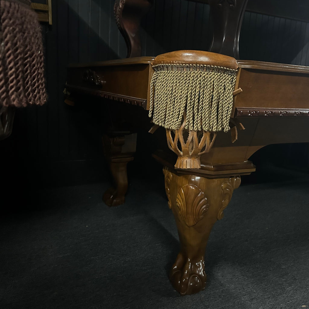 Corner view of Oversized 8ft pool table with tassel fringe pocket and clam shell details