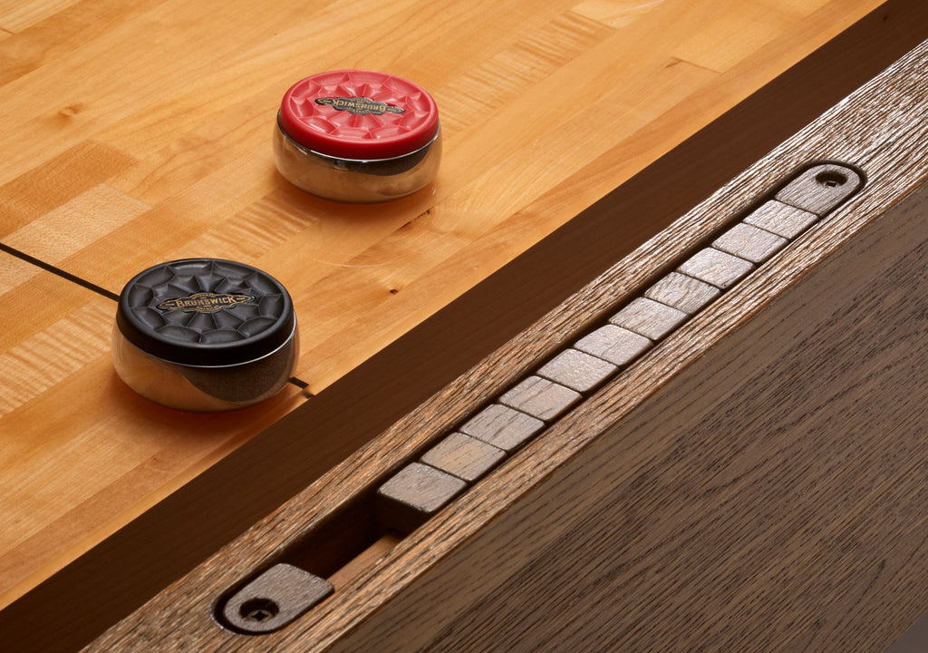 Abacus scorer on rail with black and red pucks