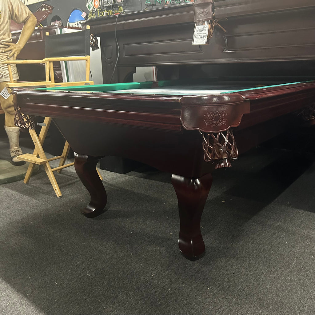 Corner view of pool table in mahogany with leather shield pocket and queen ann leg