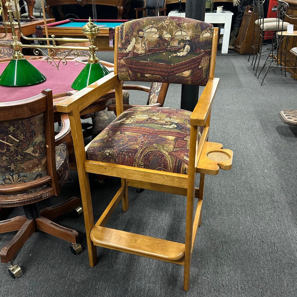 Overall view of one oak spectator chair with cloth seats pool scene and cue rest cup holder