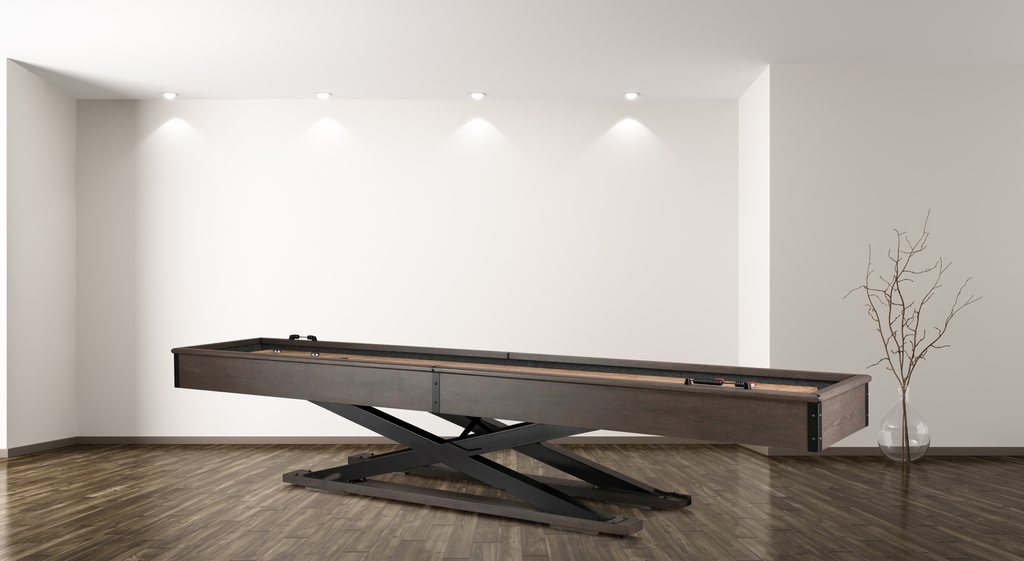 Glacier finish quest shuffleboard table from side showing x shaped leg base in room