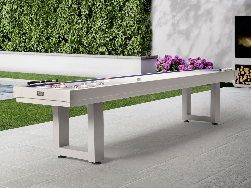 Black outdoor shuffleboard on angle in the garden with pucks