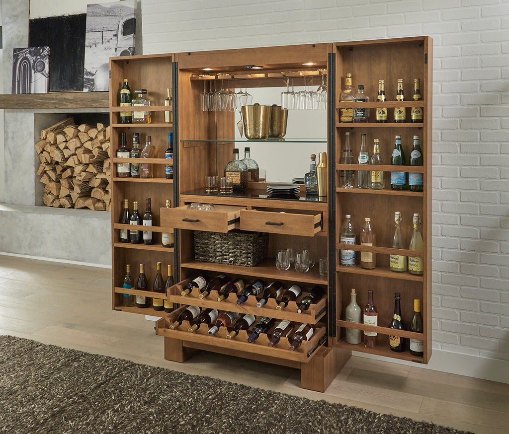 Alta bar cabinet in room at angle with bottles inside