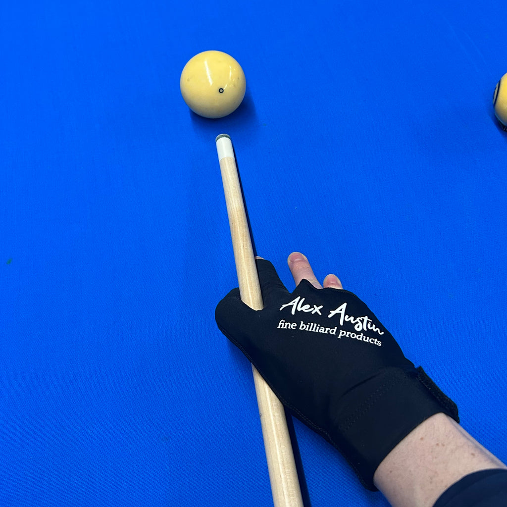 black right handed alex austin pool glove on pool table with blue felt